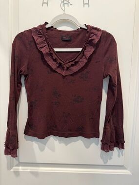 Melani ruffled long-sleeve blouse in a dark red floral
print